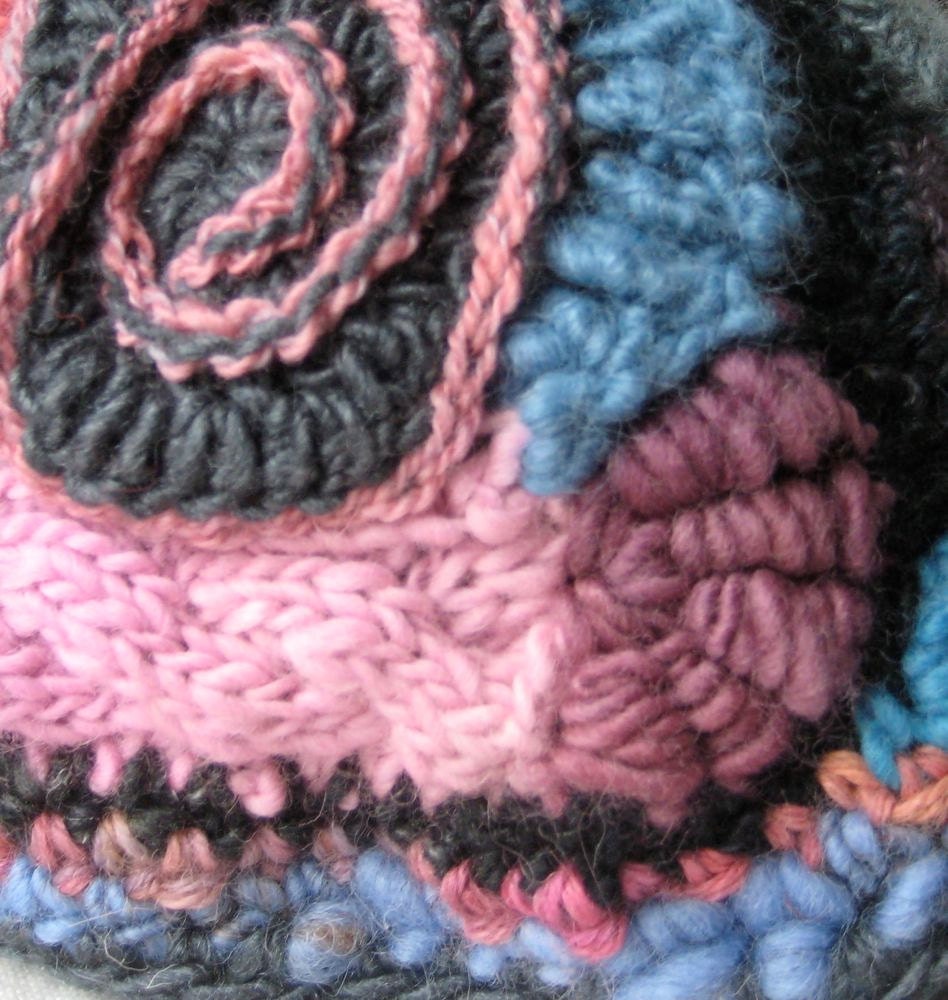 Tea Cozy made in Freeform Crochet and knitting - blue, pink, and charcoal with a hat