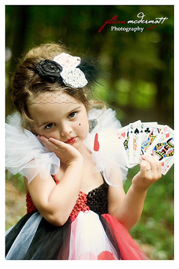 Queen of Hearts inspired tutu dress. Crocheted red and black top. White tutu collar with spades and hearts. Featured in Model Life magazine