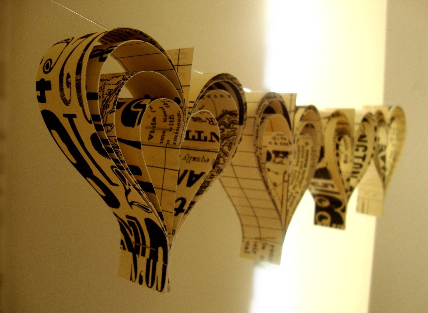 Love paperie   a garland of hand cut hearts
