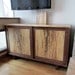 Entertainment center in a natural edge walnut.