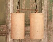 Chandelier Lighting with Twin Burlap Cylinders and Antique Brass Spreader Bar and Black Twisted Wire