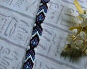 Tribal bracelet in bright purple, teal, black and white. Friendship bracelet.