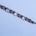 Rhinestone studded friendship bracelet.