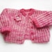 Hand Knitted Baby Bolero Jacket with Crocheted Flower - Pink, 3T