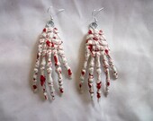 White Blood Stained Skeleton Hand Earrings