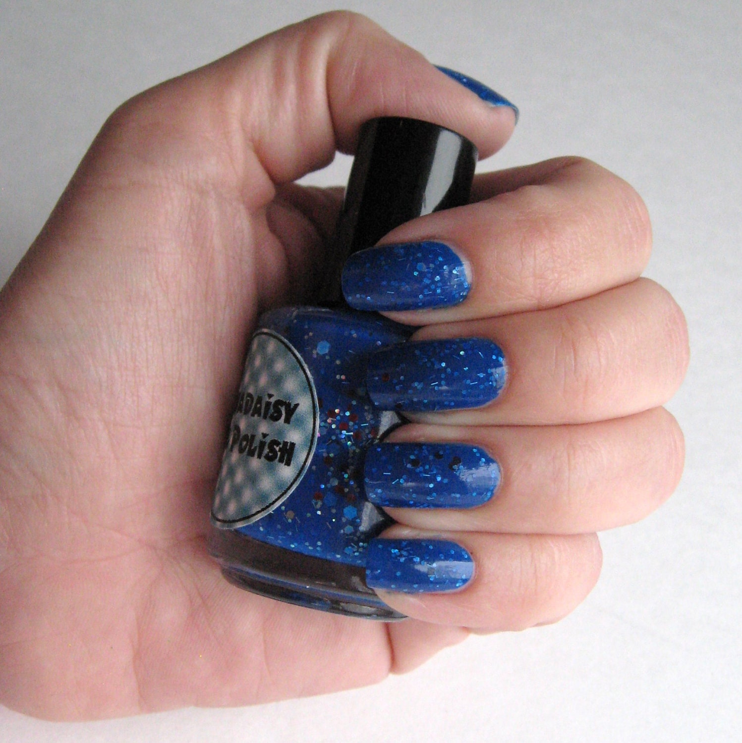 Blue and holographic glitter nail polish You're a Firework