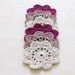 Crochet flower coasters / garland or embellishment / white cream and purple / set of 6