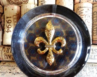 Paperweight, Round Glass.  Gold FLEUR DE LIS Re Purposed Earring on a Patterned Silk Background Ooh La La
