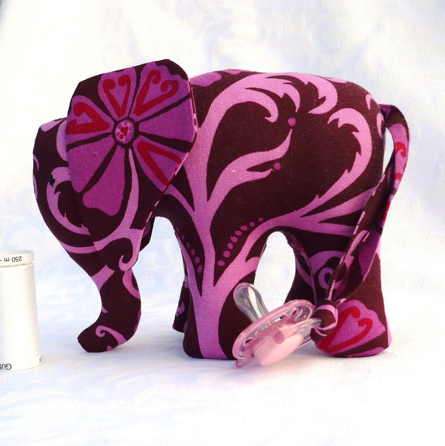 Elephant toy in pink and brown with pacifier tail and sound. Made to order.