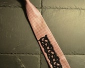 Rose silk necktie with black embroidery adornment