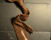 Brown necktie with rose embroidery adornment