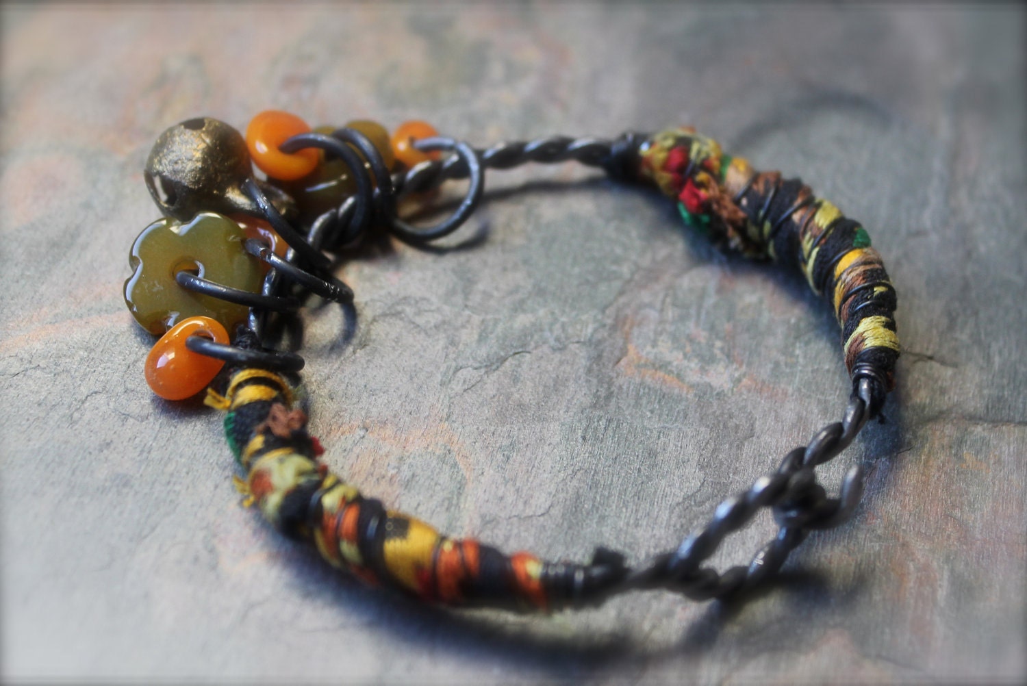 BOOMLAY, Twisted blackened steel tribal bracelet, exotic fiber wrapped bangle, orange, yellow,green