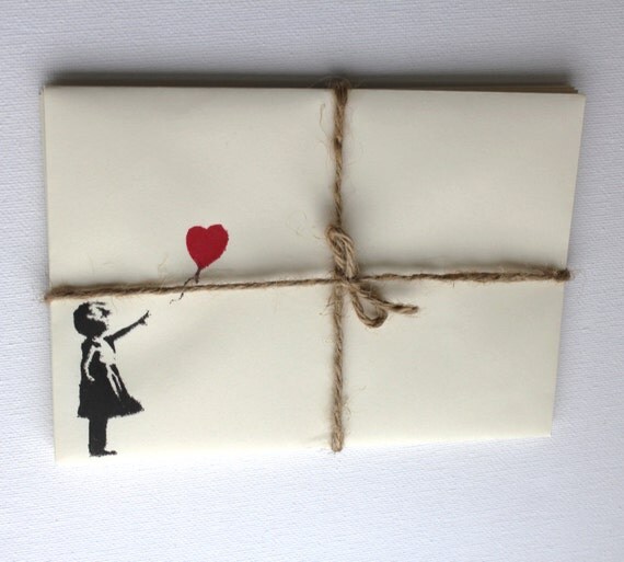 Five 5 ivory pastel envelopes, with red and black loveheart balloon girl on the front. Banksy style. cream stationary