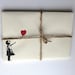 Five 5 ivory pastel envelopes, with red and black loveheart balloon girl on the front. Banksy style. cream stationary