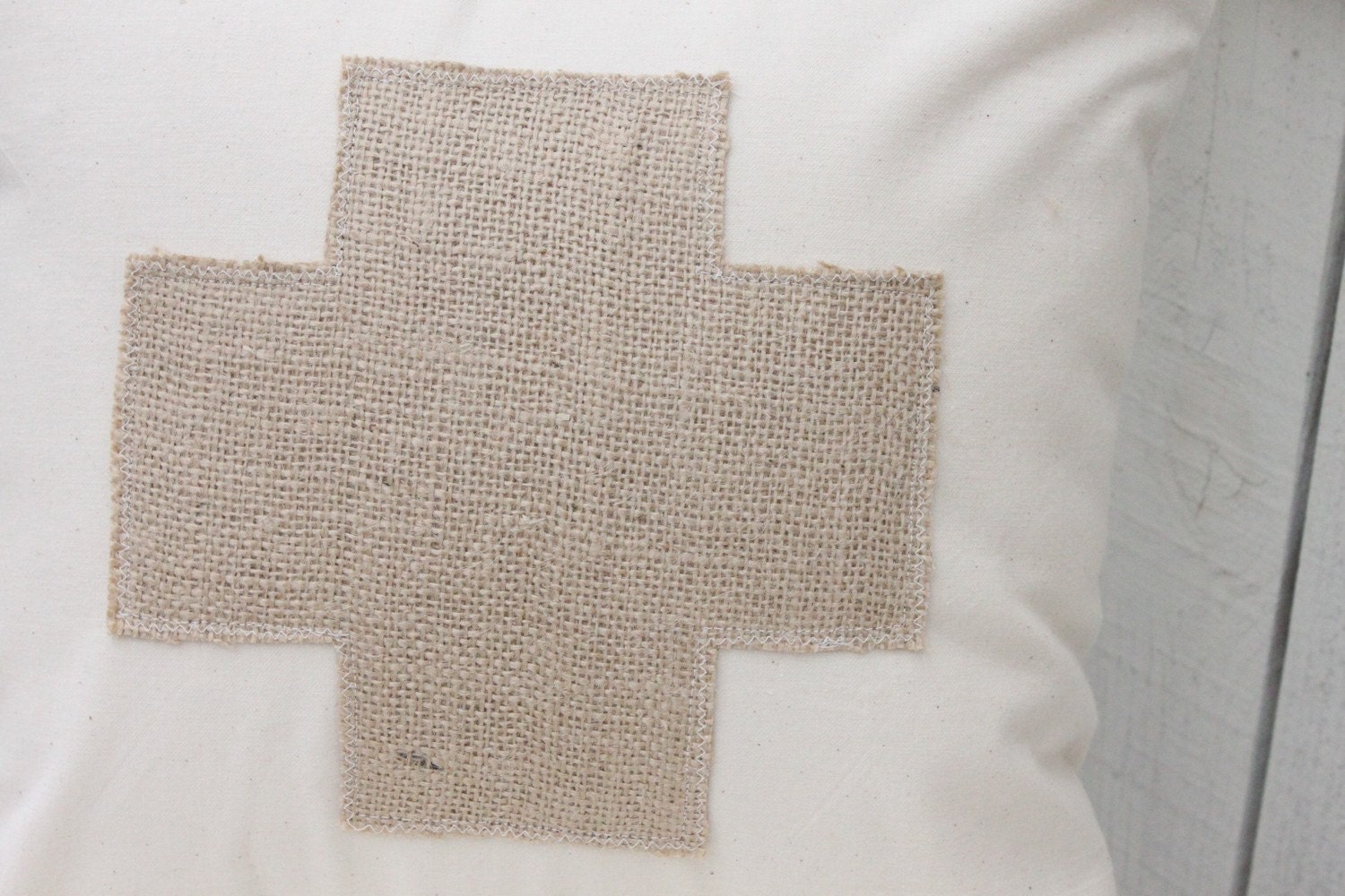 Burlap Swiss Cross on muslin pillow