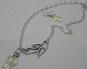 Hunger Games inspired mockingjay with gold and green leaves