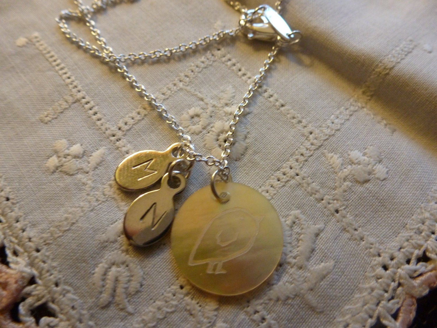 Sterling Silver Necklace with a Mother of Pearl "Chick" Pendant and 2 Initial Charms