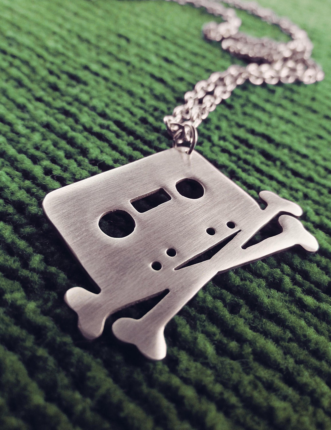 Tape and Crossbones Pendant Necklace The Pirate Bay Cassette