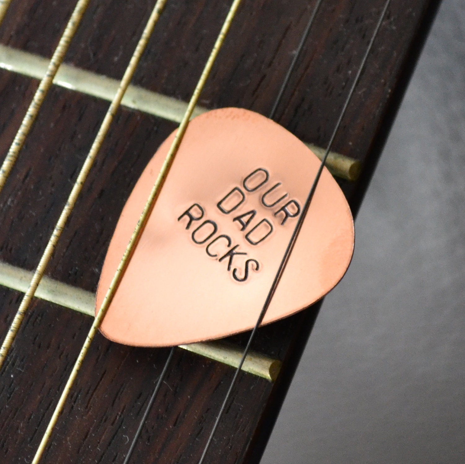 Custom Copper Guitar Pick - OUR DAD ROCKS handstamped pic