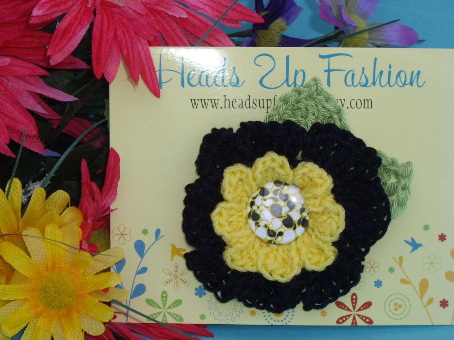 Black and yellow crocheted flower hair clip