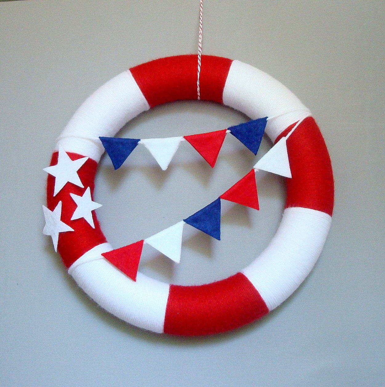 Patriotic Yarn Wreath. 12 inches. United States of America door wreath with red, white and blue felt bunting and white felt stars.