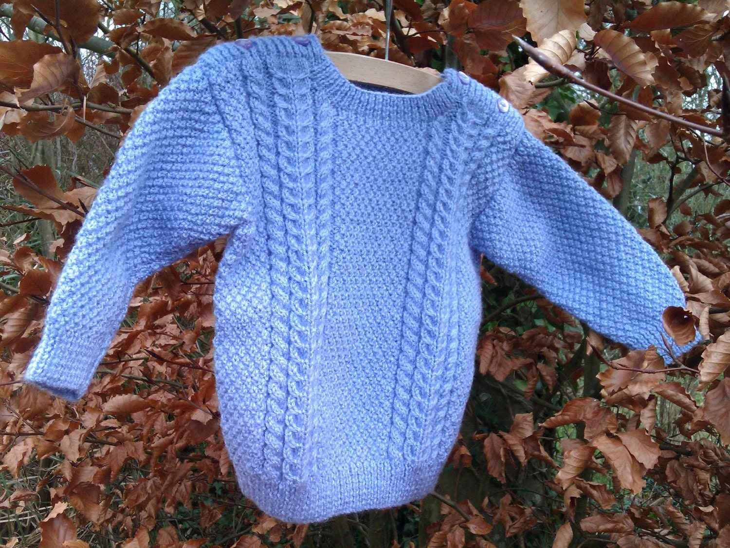 Girl's mauve cable sweater