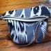 T R A V E L collection Leather and cotton clutch, cream color