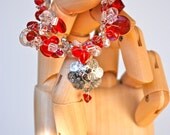 Knitted Silver Wire And Red Glass Bead Bracelet With A Hand Stamped Silver Metal Charm