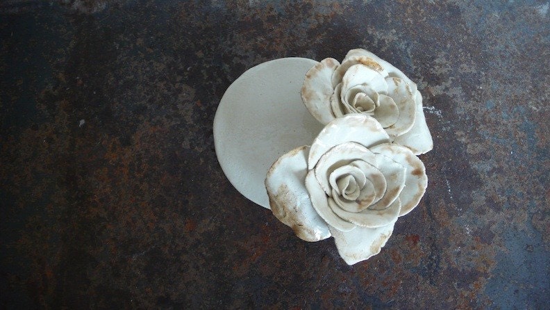 Candle holder with roses.