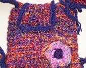 Backpack Crocheted in Bulky Purples, Maroon, Rusts adjustable Drawstring, Lined, with Flap and Flower