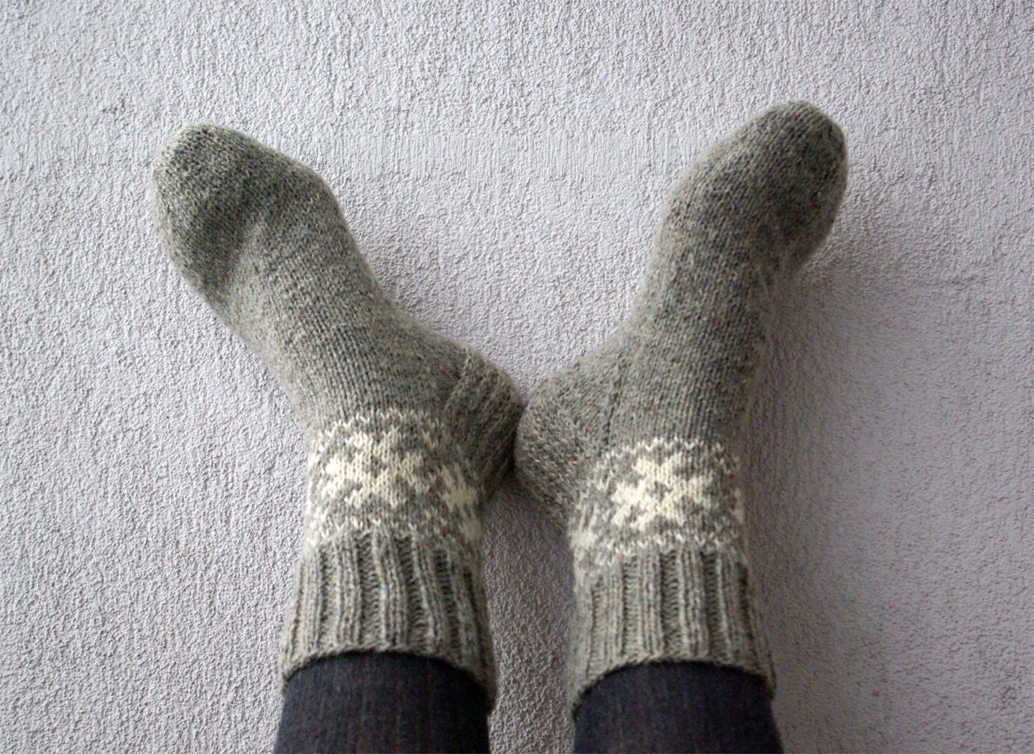 Hand knitted socks  from grey wool yarn. With white ornament.