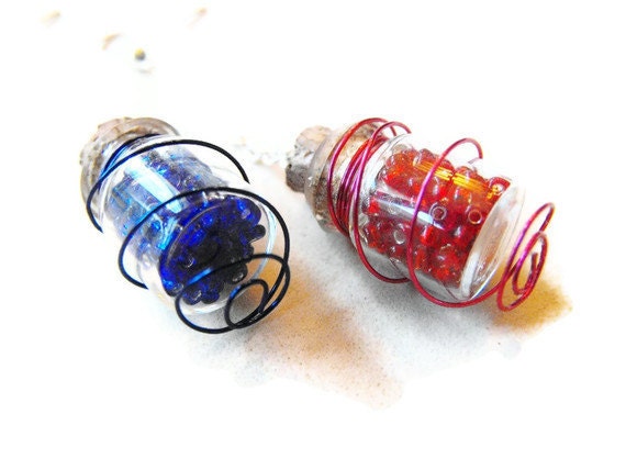Wire wrapped mana and health potions- miniature bottles filled with red and blue glass bead and wrapped with its corresponding wire