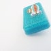 Space ship blue glitter badge pin