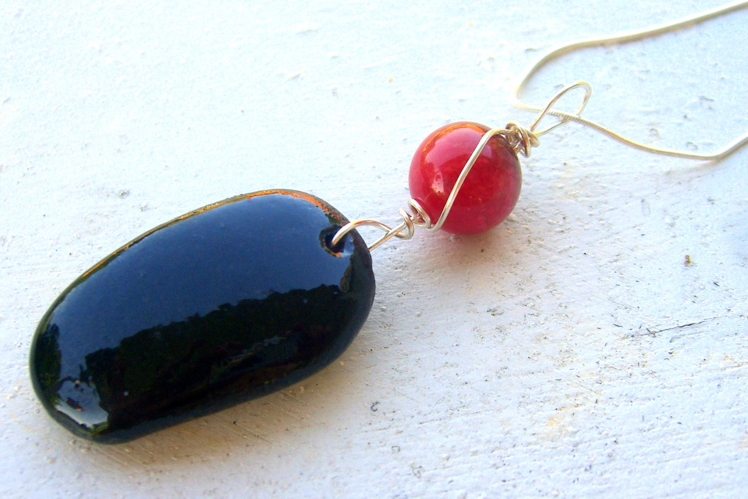 Black sea glass pendant with wire wrapped large red jade accent