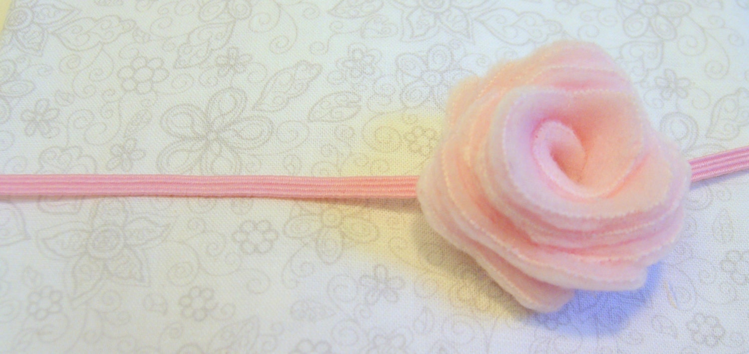 Pink felt rosette on skinny elastic headband