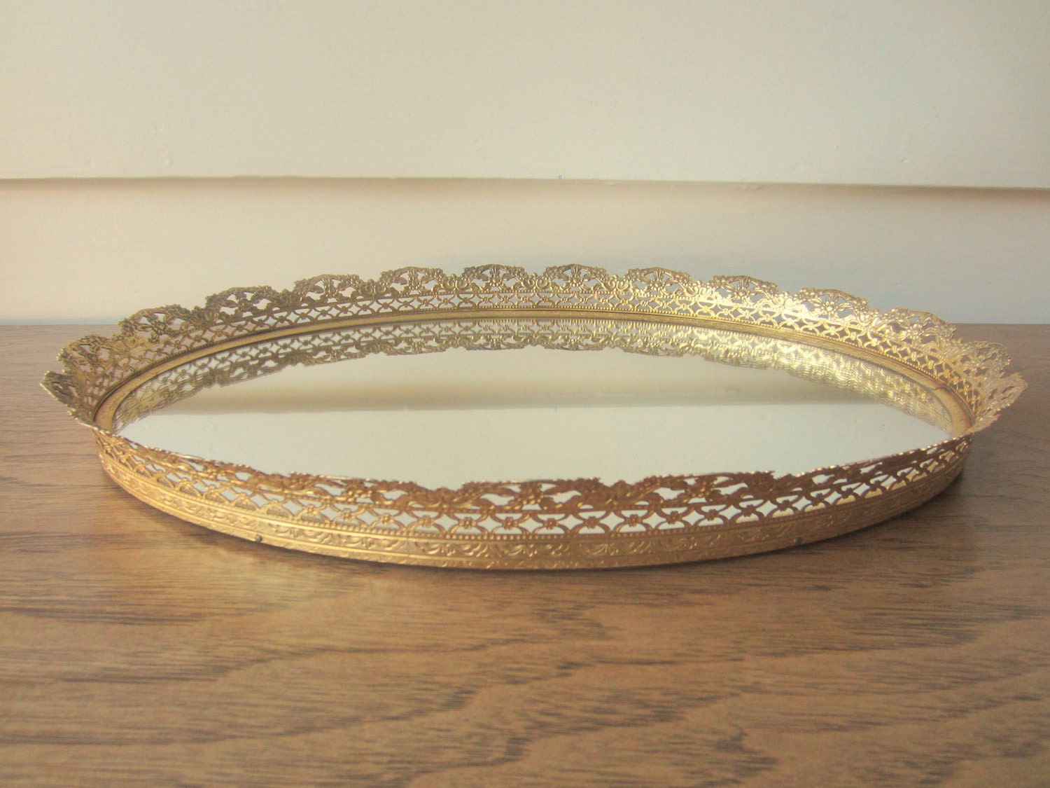 Vintage gold oval mirror dresser caddy.  Gold filigree dresser mirror.