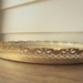 Vintage gold oval mirror dresser caddy.  Gold filigree dresser mirror.