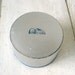 Vintage Avon powder box round metallic silver Art Deco print