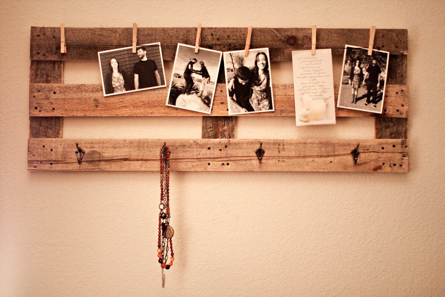 Picture hanger with hat and jewelry hangers