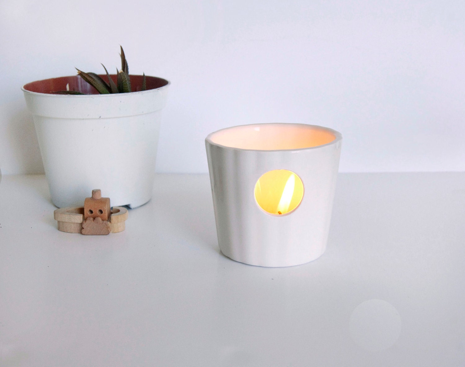 White ceramic candle holder with geometric motif