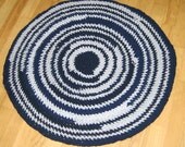 Rag Rug 32 inch round floor mat made from upcycled tshirts I call this one "Dizzy if you dare" Navy blue and grey