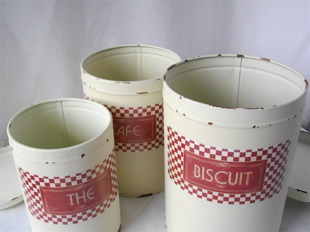 Vintage French white metal canisters.