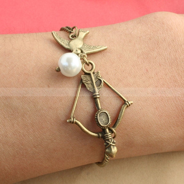 The Hunger Games charm bracelet, Katniss bow  with Mockingjay and Peeta pearl Bracelet inspired by The Hunger Games