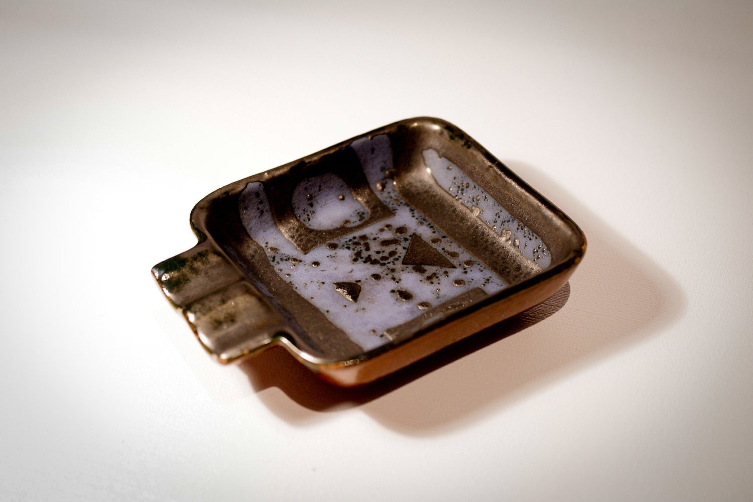 Cool shaped little ceramic ashtray, special oily lava glaze "Ankara" Carstens West Germany 326