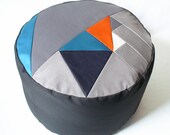 Pi geometric patchwork pouffe.