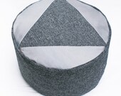 Triangle Tweed patchwork pouffe.