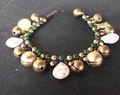Thai handmade Jingle bell bracelet woven with dark brown wax rope weaved togeter with brass beads jade stone