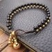 Black balls brass bracelet