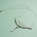 Silver bow and arrow necklace