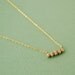 Tiny golden skull necklace